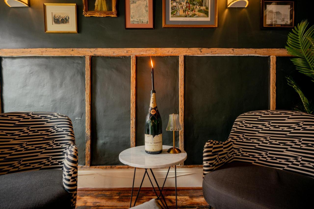 TwentyTwo interior seating with dark panels and framed artwork